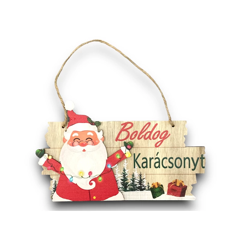 Karácsonyi dekor fa tábla hóemberrel, ajándékokkal és fenyőfás háttérrel, „Boldog Karácsonyt” szöveggel.